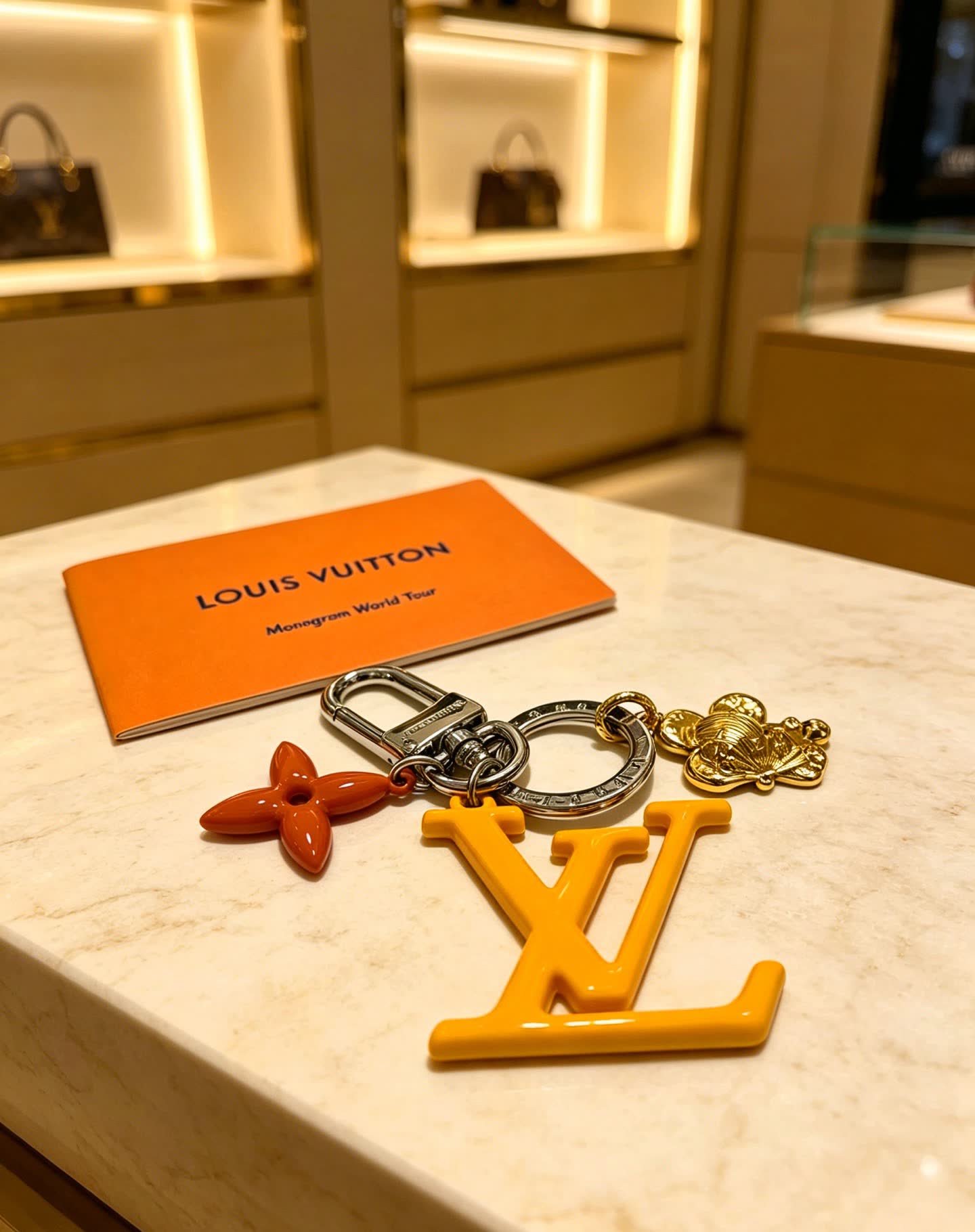 Louis Vuitton Keychain with LV Logo and Monogram Motif